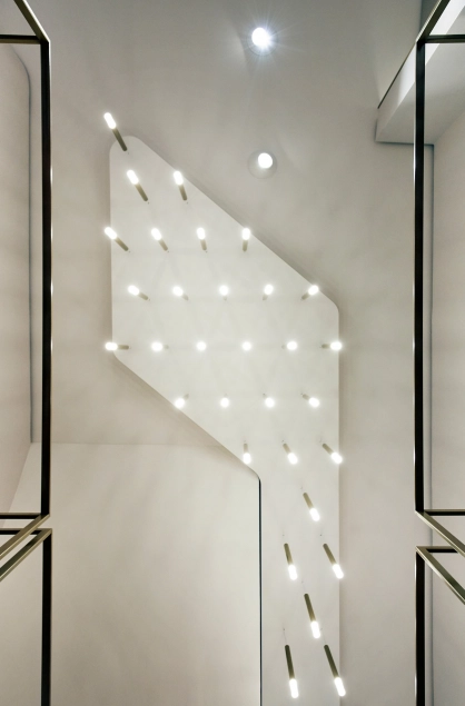 shop design - Reconstruction and new design of a shop - Blue Lemon Basel - store ceiling lamp illumination detail