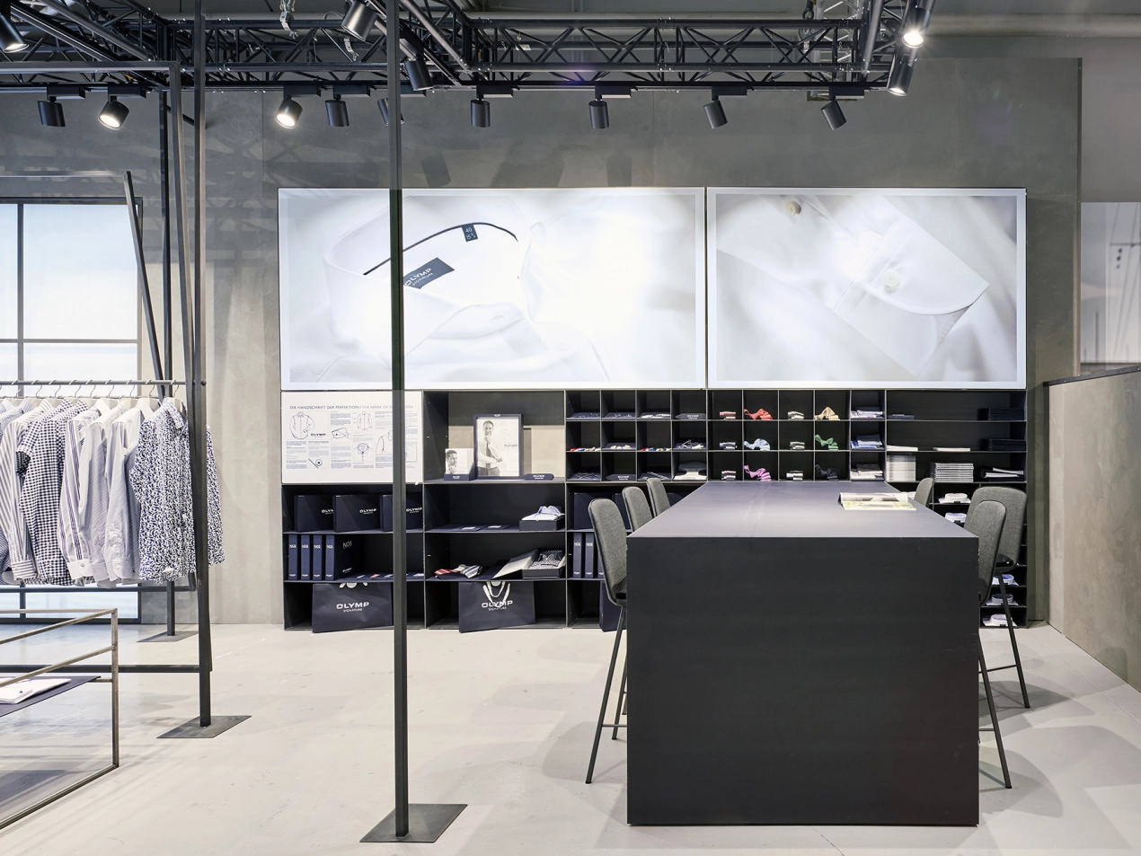 Signature fair booth - Concept und realisation - Olymp Signature Premium Berlin 2017 - view to conference table in fair booth