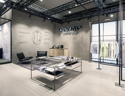 Signature fair booth - Concept und realisation - Olymp Signature Premium Berlin 2017 - view to logo wall with infographic