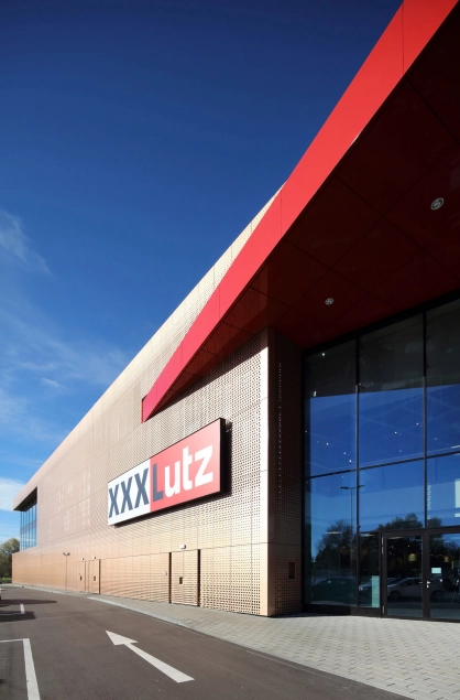 furniture store - new construction - XXXLutz Kempten - entrance - facade materials - logo